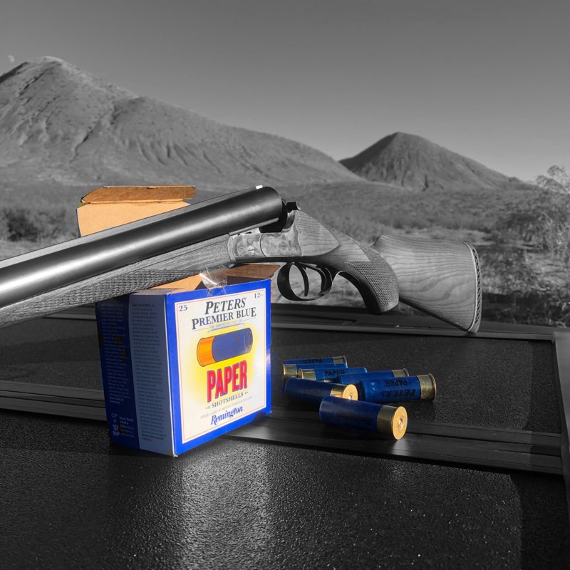 Peters Paper Shotgun shells and a classic side by side shotgun